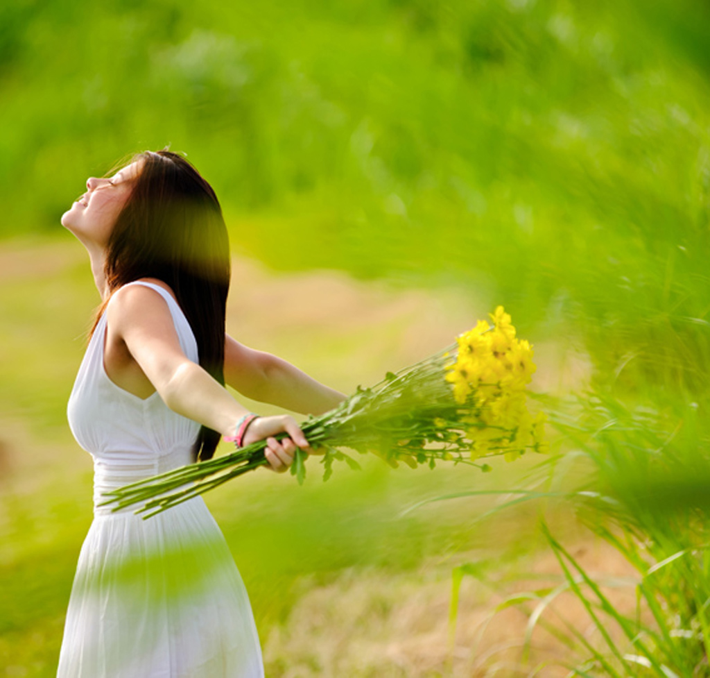 carefree attractive girl in field